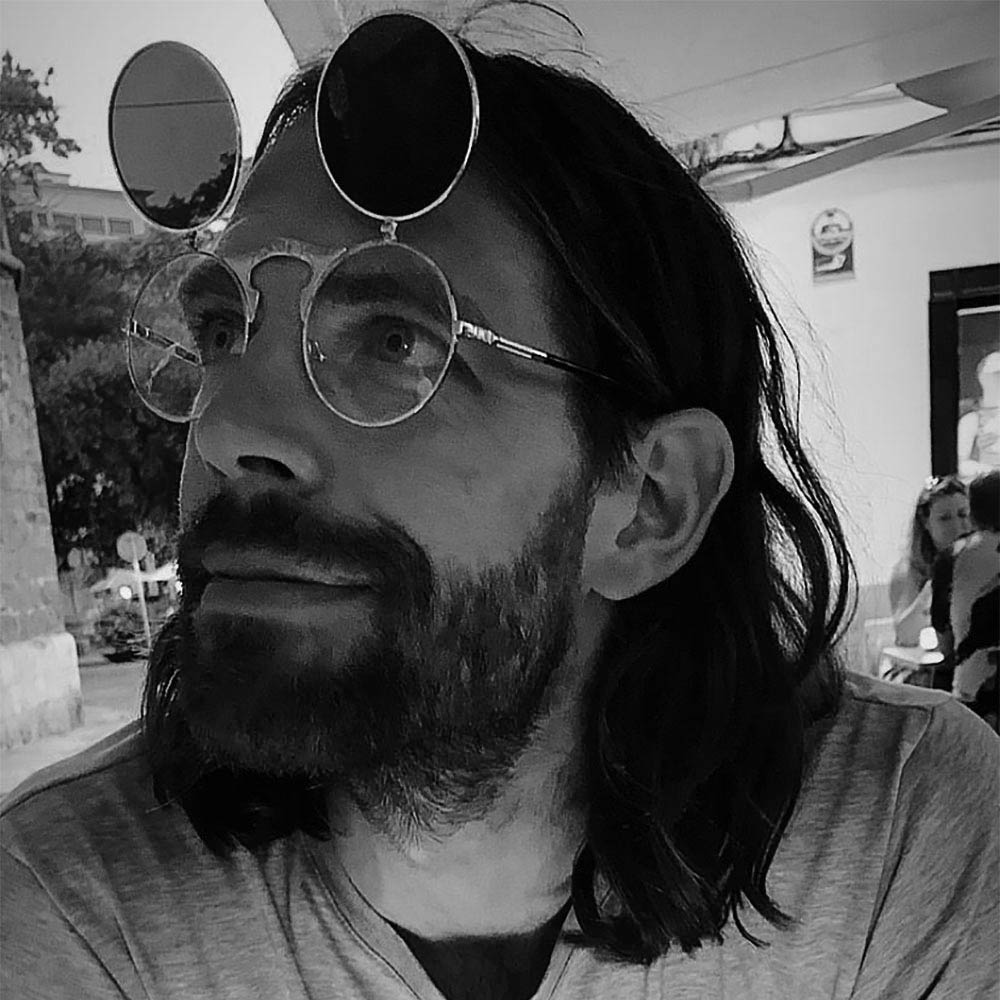 Matt Steel, British product designer wearing glasses. Founder of INTI.